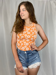 Orange and white daisy print bodysuit.
